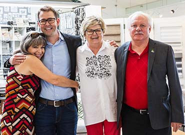 Patients and doctor hugging