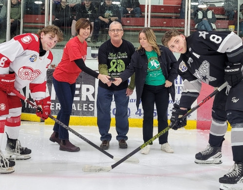 Larry Drops Puck with North Battleford Mayor and Lung Sask CEO