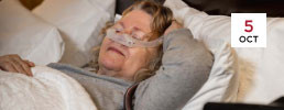 Woman sleeping with sleep apnea machine