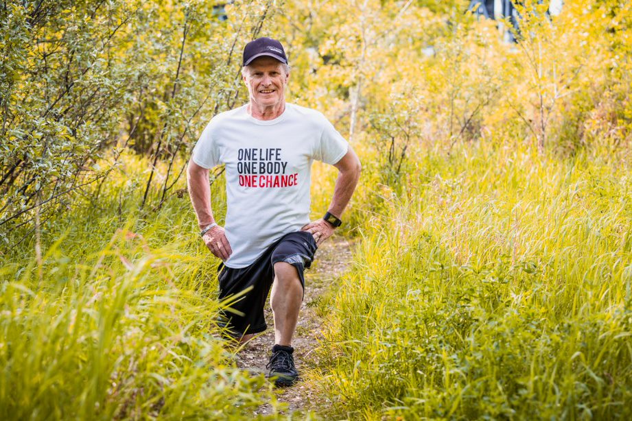 man jogging through a field