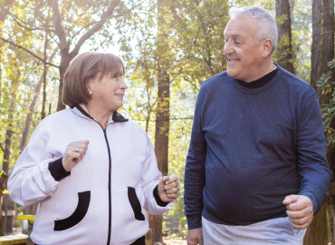 Two people walking in park