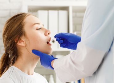 Image of patient getting throat swab