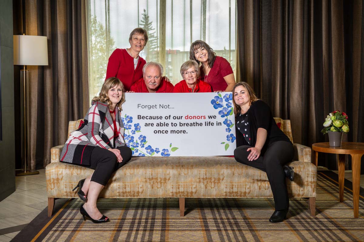 4 people sitting on couch