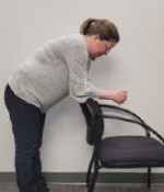 person leaning forward on a chair