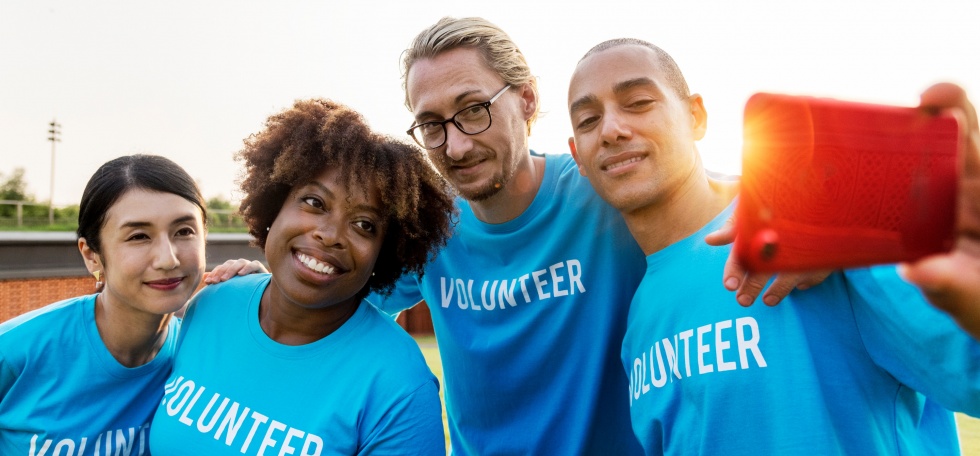 group of people wearing volunteer shirts