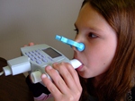 girl taking spirometry test