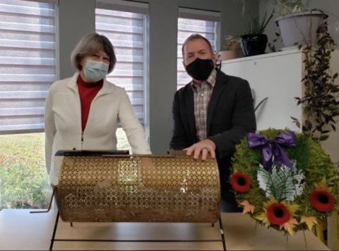 Man and woman standing at raffle bin