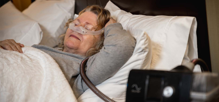 woman with a cpap in a bed